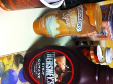 Caramel and Chocolate sauce are absolute necessities. And whipped cream, if you can manage it.